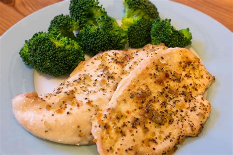 Place chicken in a broiler pan. bake boneless skinless chicken breasts in oven
