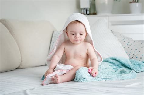Premium Photo Baby Boy Covered In Towel After Bathing