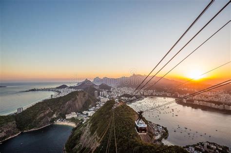 Sugarloaf Mountain In Rio De Janeiro At Sunset With View Over City