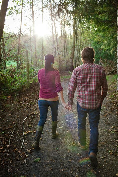 A Young Couple Hold Hands While Walking Photograph By Christopher Kimmel Fine Art America