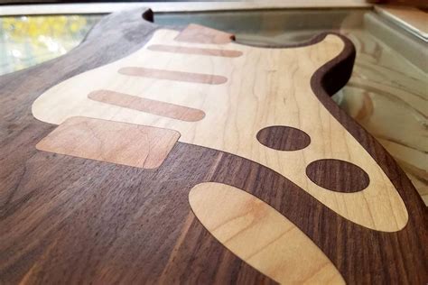 It's also a new way to decorate your kitchen. These guitar-shaped kitchen cutting boards are made for a ...