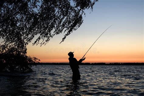 Fisherman Silhouette At Sunset Stock Photo Image Of Reel Dawn 75361152