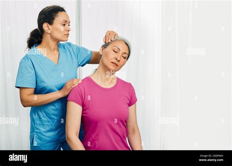 Manual Therapist Massaging Mature Womans Neck At A Rehabilitation Center Exercise Treatment