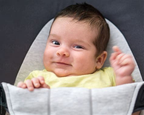 Smiling Baby Waving By Stocksy Contributor Acalu Studio Stocksy