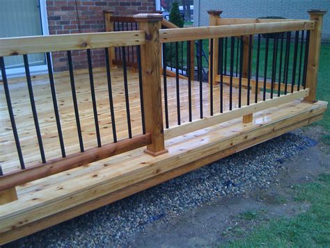 Jun 30, 2021 · this deck has an excellent view, which includes the yard below it and surrounding landscaping. Wood Deck Railing With Metal Balusters | Home Design Ideas