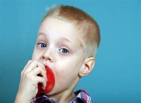 Child Eating Apple Little Boy Eating With Appetite A Big Apple Stock