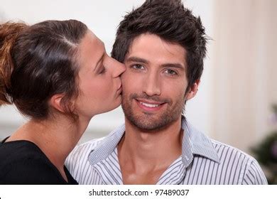 Woman Kissing Man On Cheek Stock Photo Shutterstock