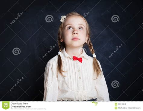 Cute Little Girl Looking Up On Blackboard Stock Image Image Of