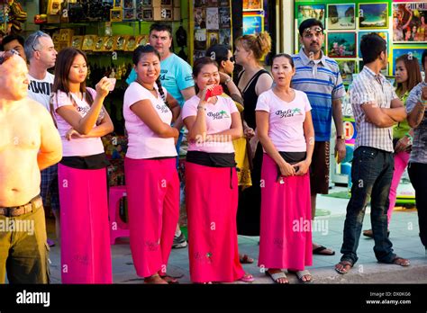 Massage Girls Watching A Parade In Patong Phuket Thailand Stock Photo