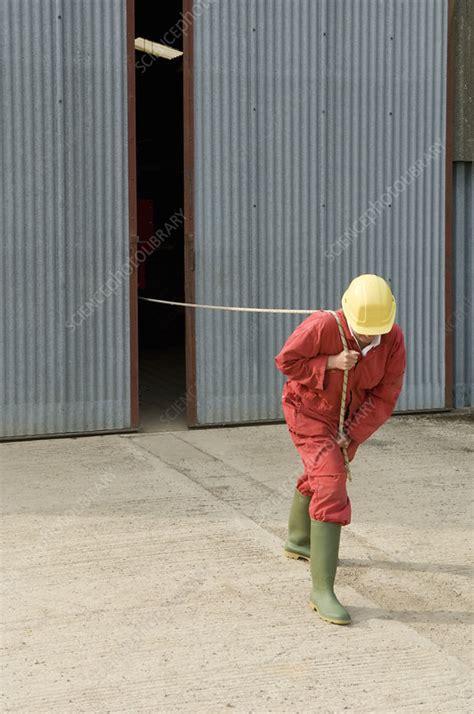 Worker Pulling Unseen Object Stock Image F0040119 Science Photo