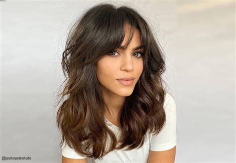 32 ways to pair wavy hair with bangs for a super flattering look artofit