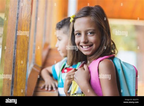 Portrait Of School Girl Standing In School Corridor Stock Photo Alamy