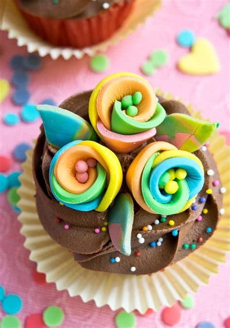 I love how these turned out, and i have created a step by step video tutorial showing exactly how i made each of the toppers. How to Make Rainbow Flower Cupcake Toppers • CakeJournal.com