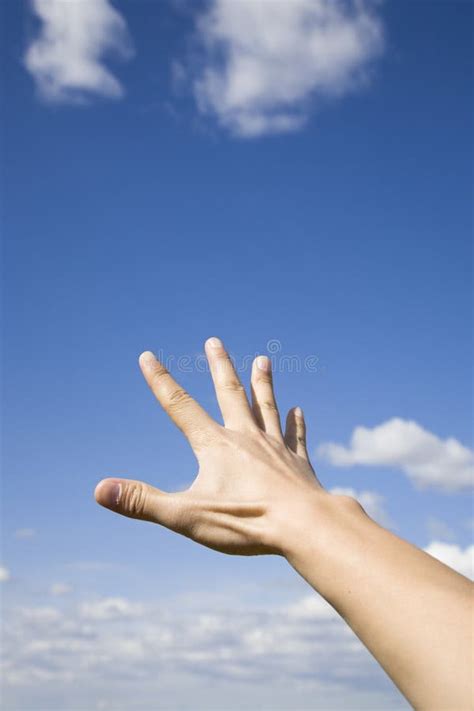 Hand Reaching Up To Sky