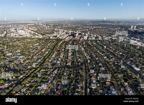 Afternoon Aerial View Of Beverly Hills Streets With Mid Wilshire And