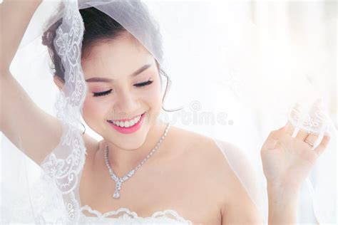 portrait of a beautiful asian bride wearing white wedding dress stock illustration