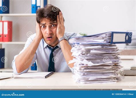 The Overloaded Busy Employee With Too Much Work And Paperwork Stock