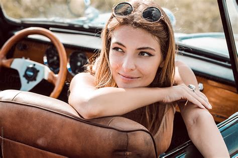 Young Woman Posing In Convertible Car By Lumina Trip Woman