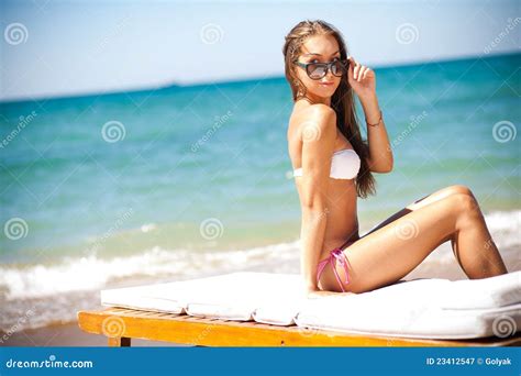Beautiful Woman On A Beach On A Chaise Lounge Stock Image Image Of