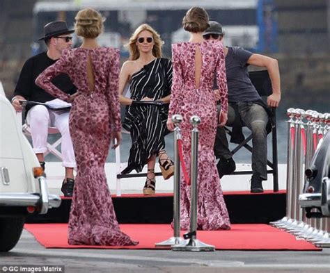 heidi klum flaunts pert posterior and taut tummy in self designed swimwear revealing she s