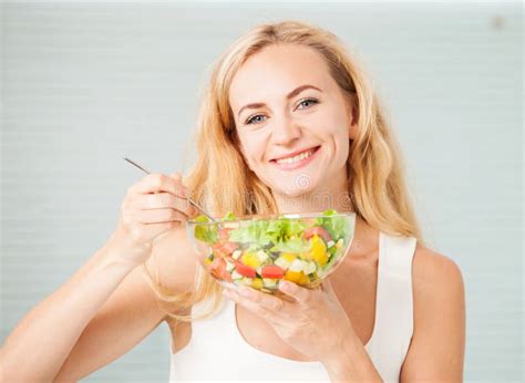 Young Woman Eating Vegetable Salad Stock Photo Image Of Indoors