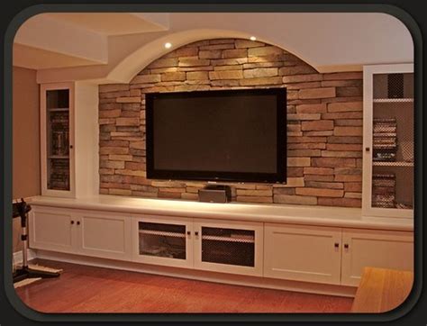 A gallery featuring a number of luxurious rustic and contemporary living rooms, all with beautifully built stone fireplaces. Stone Fireplace and Stone TV Wall