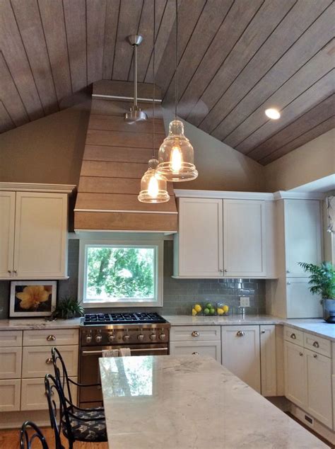 HOOD CONCEPT Shiplap siding was added to the Kitchen ceiling and range