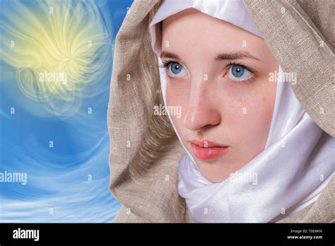 Beautiful Pure Girl With A Clear Look In A White Scarf Addresses Prayer