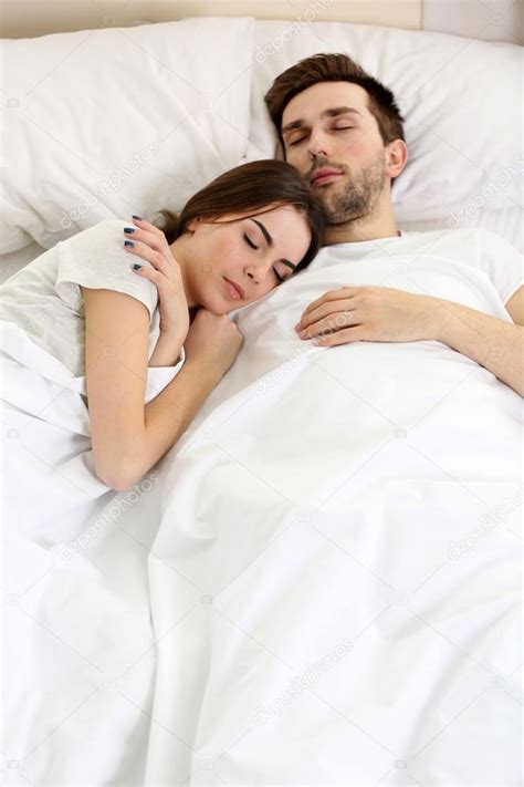 Couple Sleeping Together In Bed — Stock Photo © Belchonock 103420778