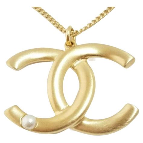 Chanel Gold Tone And Pearl Cc Logo Necklace At 1stdibs