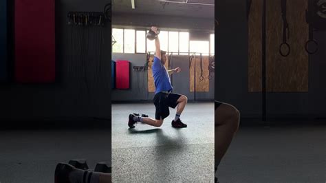 Overhead Weighted Lunges With Dumbbell And Kettlebell Youtube