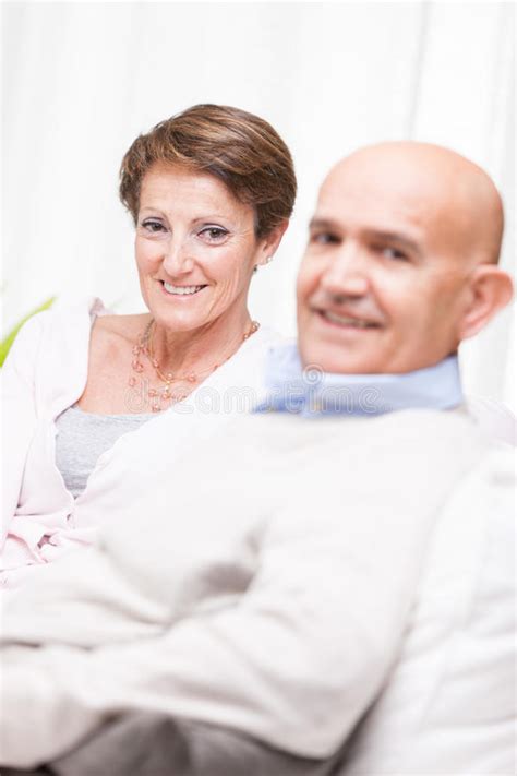 Happy Middle Aged Couple Relaxing At Home Stock Image Image Of