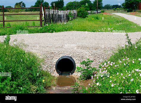 Drainage Pipe New Culvert Under Small Country Side Gravel Road Stock
