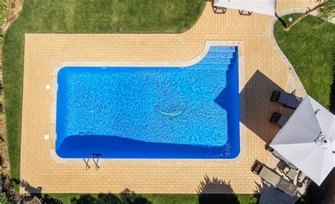 Premium Photo Aerial View Of Swimming Pool Outside Hotel