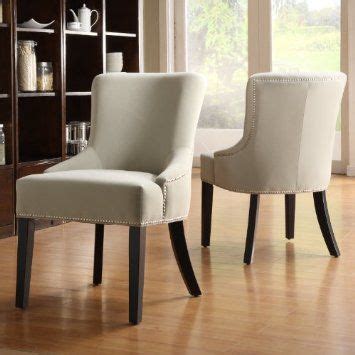 These black upholstered dining chairs are trendy and can fit into every decoration style. Upholstered Tan Velvet Chair With Black Legs, Nailhead ...