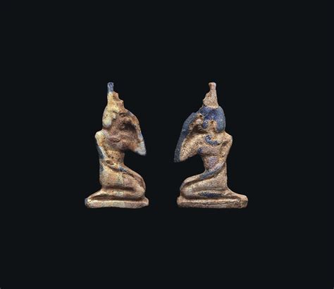 Two Egyptian Iridescent Blue Glass Mourning Isis Amulets Ptolemaic Period Circa 3rd 1st