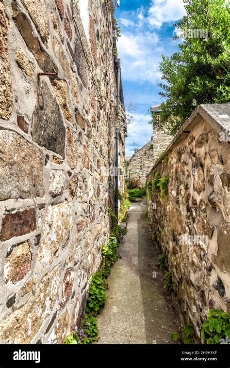Narrow Passage Between Stone Cottages In The Fishing Village Of