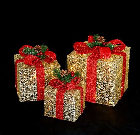 This yard decoration is crafted to look like a delicately carved boxwood hedge. LED Lighted pre-lit Christmas presents Gift Boxes ...