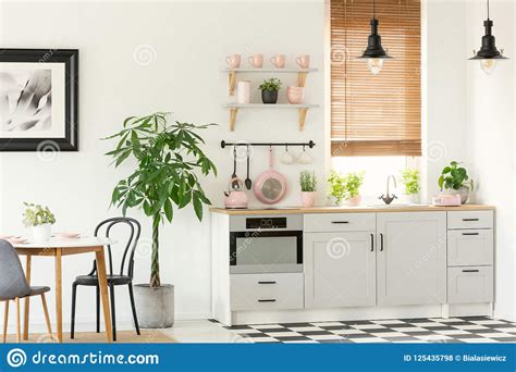By using the right design techniques, pink can add a distinctive edge to your space. Pink Accessories In Grey Kitchen Interior With Plant Next ...