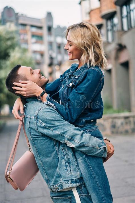 Happy Meeting Of Two Lovers Hugging In The Street Stock Photo Image