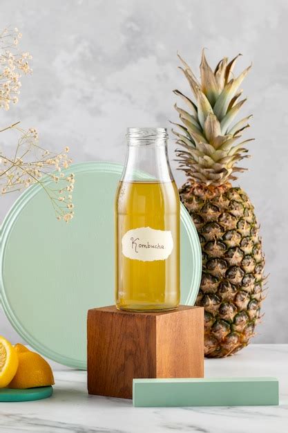 Free Photo Delicious Kombucha Bottle And Pineapple Assortment