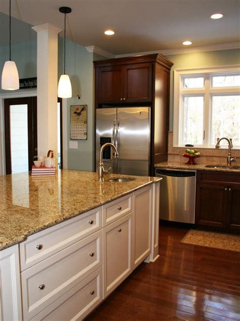 Traditional Kitchen With Large White Island and Dark Wood Wall Cabinets | HGTV