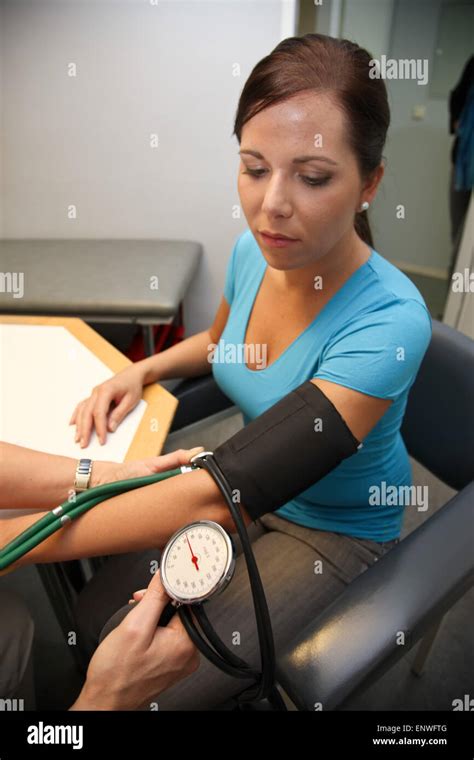 Woman Getting Blood Pressure Measurement Stock Photo Alamy