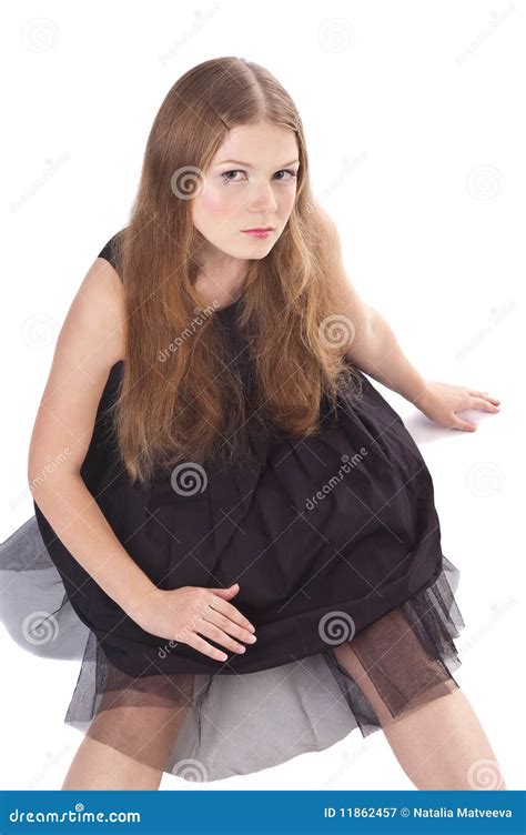Portrait Of Long Haired Girl Sitting On The Floor Royalty Free Stock