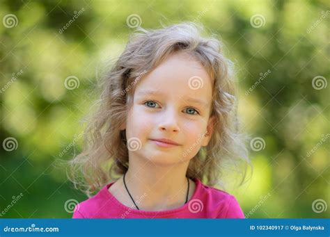 Beautiful Little Curly Blonde Girl Has Happy Fun Cheerful Smiling Face