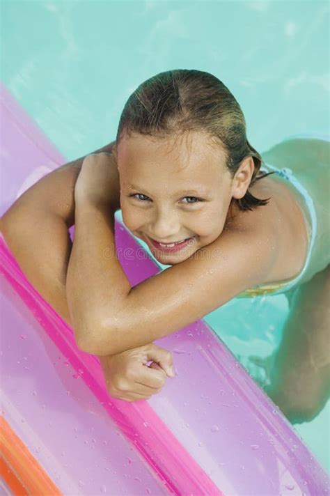 Girl In Swimming Pool View From Above Portrait Stock Photo