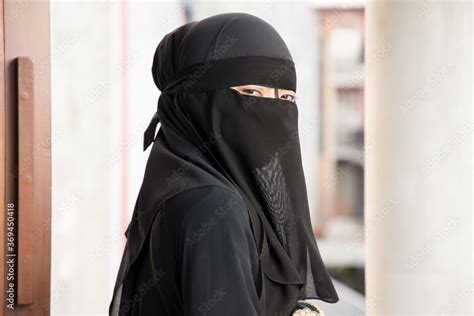 Portrait Of Arabian Woman Looking At You While Covering Her Face With Niqab Veil Traditional