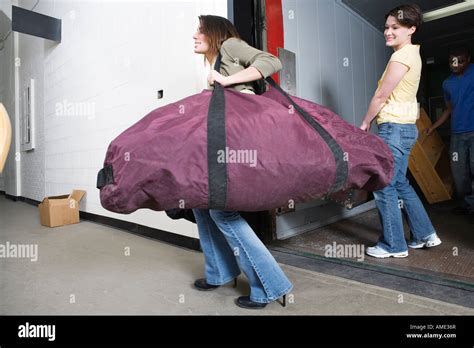 Young Woman Carrying A Huge Traveling Bag Stock Photo 15235774 Alamy