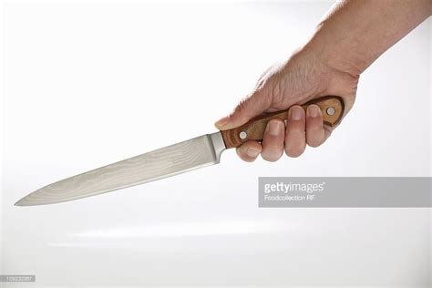 Holdingakitchenknife Human Hand Holding Kitchen Knife Stock Photo