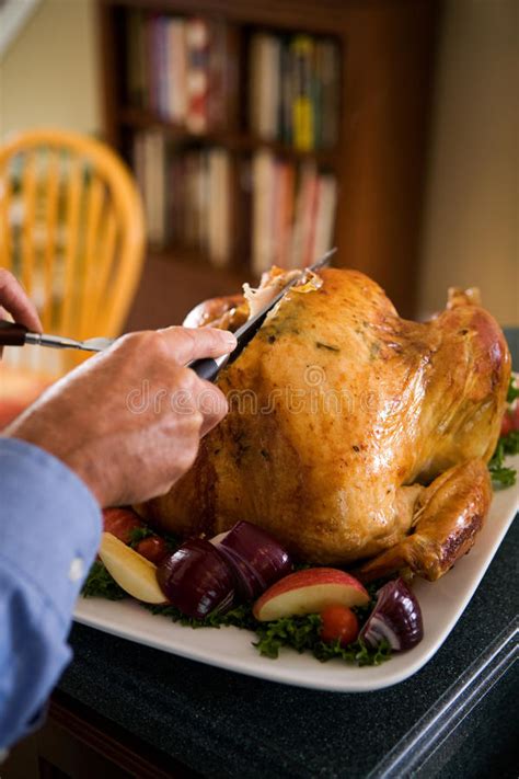 Thanksgiving Man Carving Slices Of Roast Turkey For Dinner Stock Image Image Of Kitchen